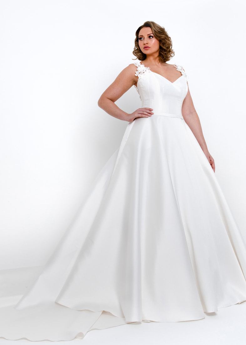 Full skirted wedding dress with sweetheart neckline and detailed straps