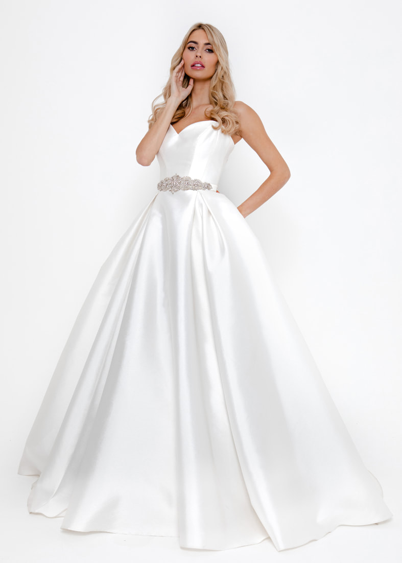 Ballgown skirt wedding dress with a sweetheart neckline and spaghetti straps
