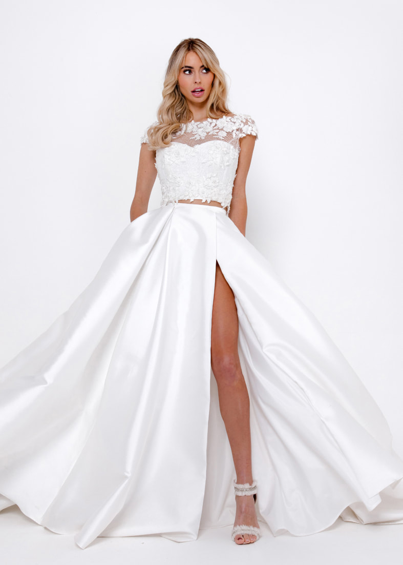 Playful ballgown bridal skirt with a thigh split. Worn with a bridal bandeau and tulle shrug