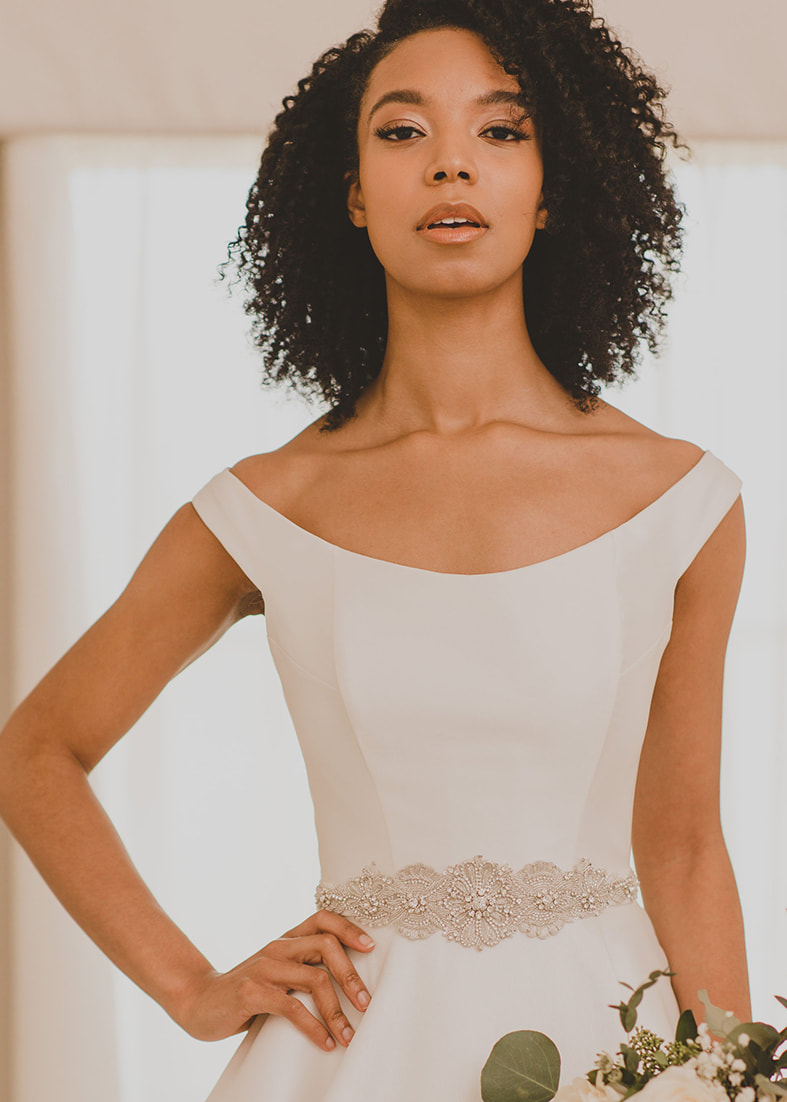 Heburn Overskirt. A beautiful fishtail fit overskirt to add extra detail to a plain wedding dress. The gorgeous daisy lace fabric gives this piece a modern feel