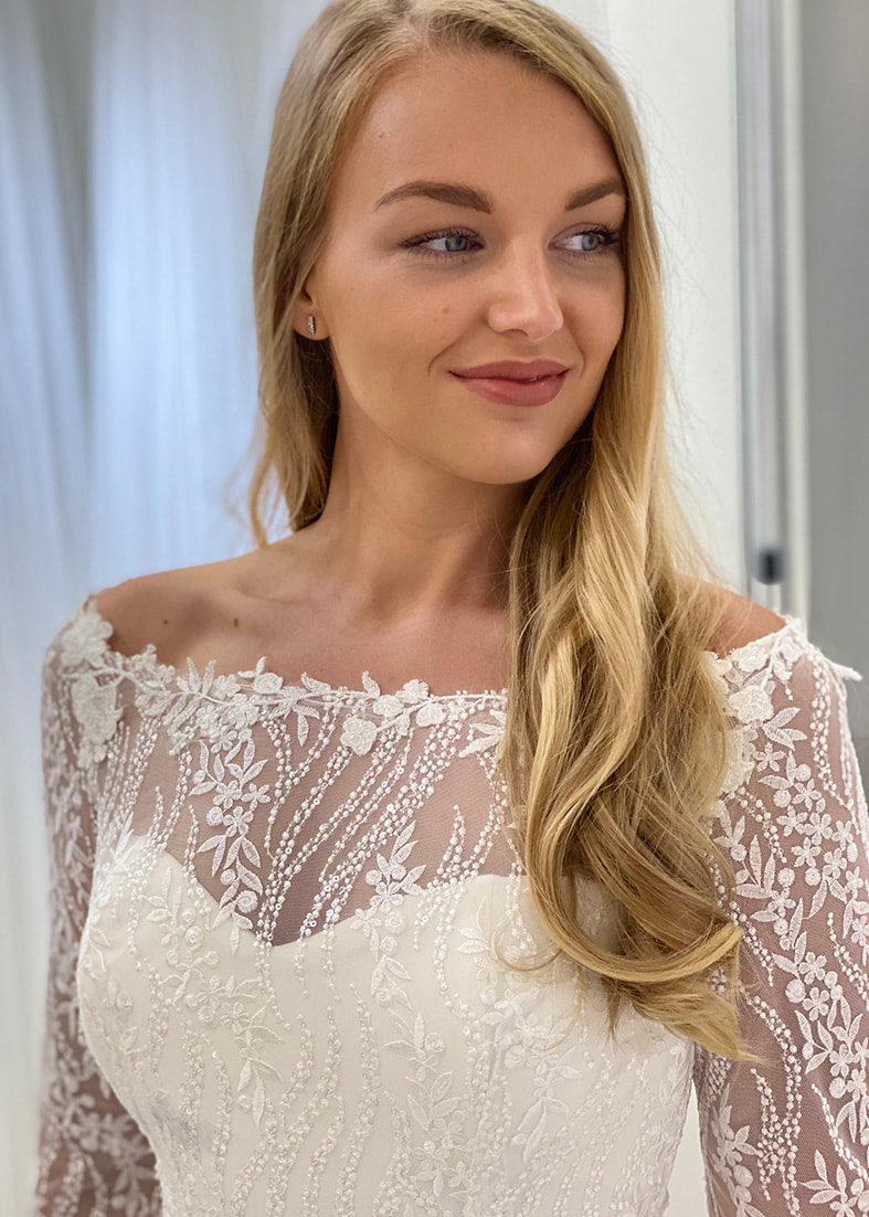 stunning bridal shrug in embroidered sequin lace and an elegant lace edged off the shoulder neckline