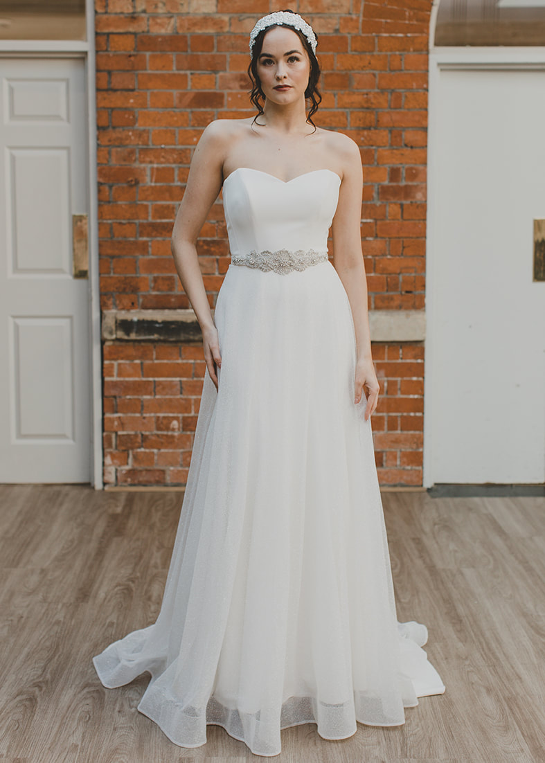 Fallon  - A-line glitter tulle overskirt. Worn over a strapless satin wedding dress with a crystal beaded belt