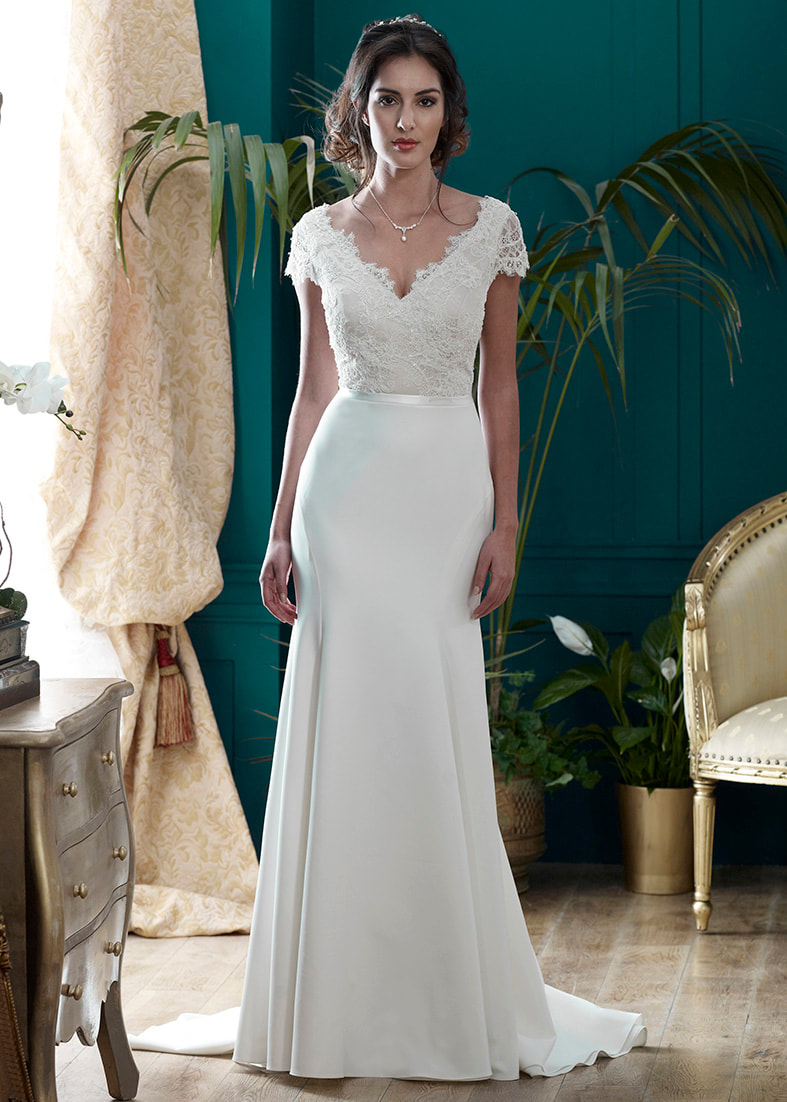 Beautiful fitted wedding gown with a v neck lace bodice and cap sleeves