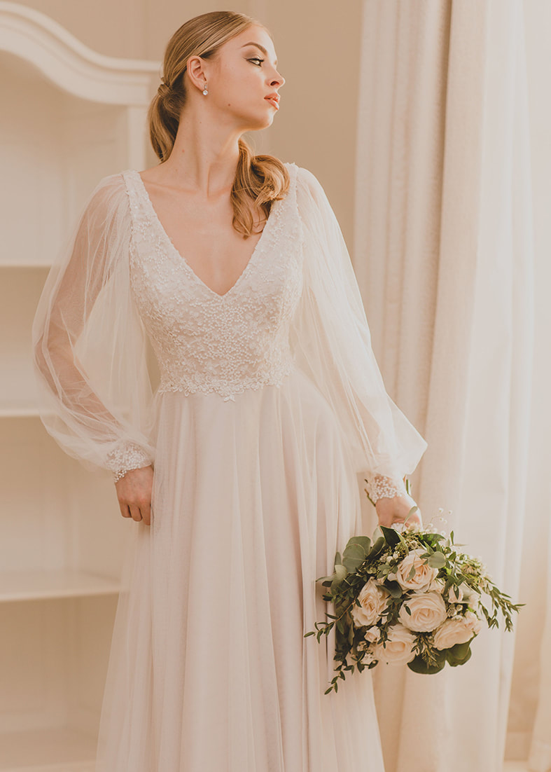 Romantic wedding dress with detachable sleeves shown without sleeves