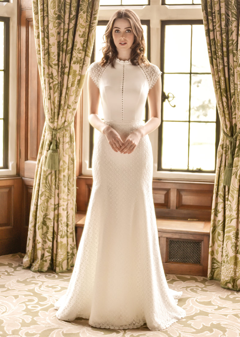 Stunning fitted vintage style gown with a high neckline & sheer lace cap sleeves