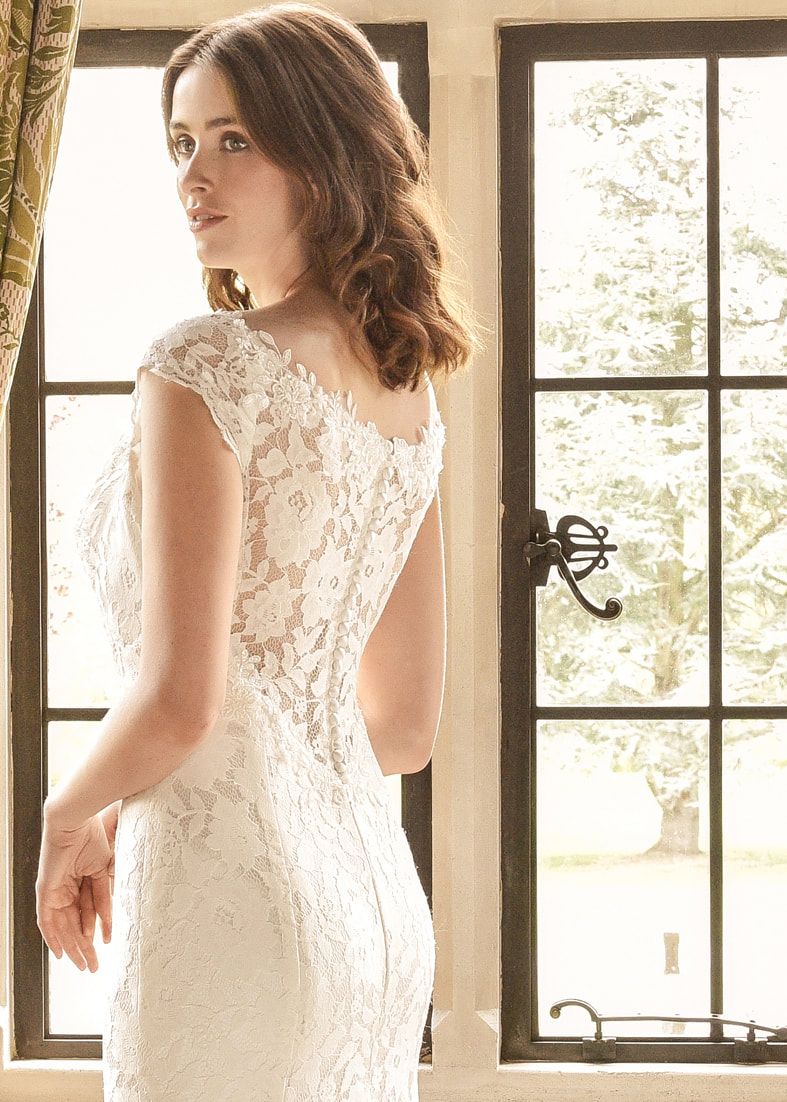 Fitted wedding dress with a sheer lace button through back  - close up back detail