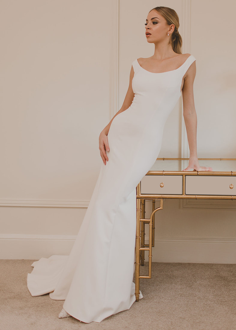 Delectable fitted gown with an off the shoulder neckline