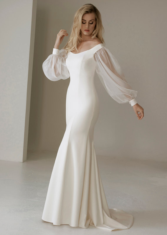 Clean and modern fitted gown with voluminous sheer balloon sleeves
