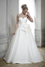 satin ballgown skirt wedding dress accessorised with an oversize bow belt