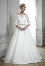 ballgown wedding dress worn with a 3/4 sleeve off the shoulder lace bridal shrug
