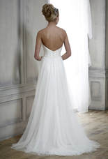 Strapless wedding dress worn with a tulle overskirt - back shot