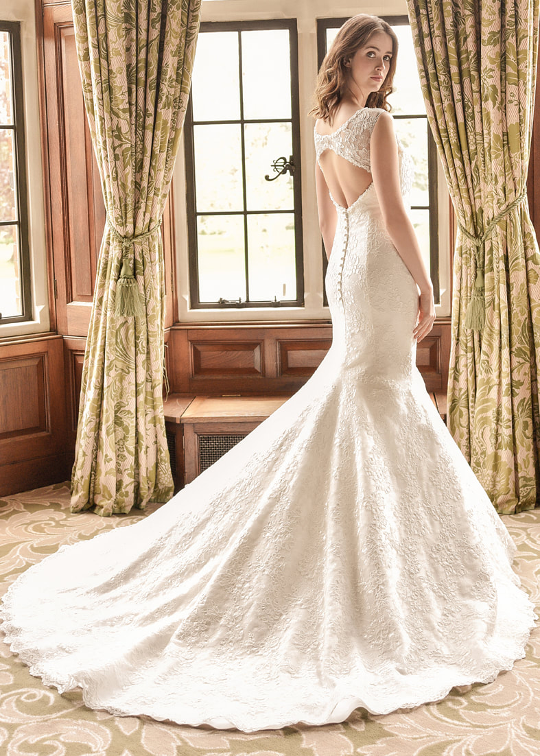 Fitted fishtail wedding dress with train and a keyhole back detail