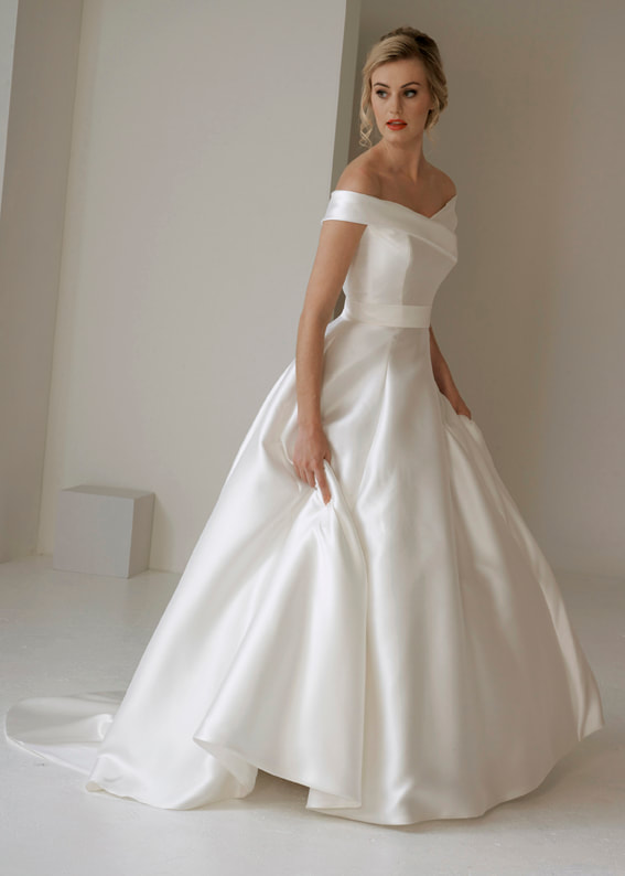 modern off the shoulder wedding dress with a ballgown skirt