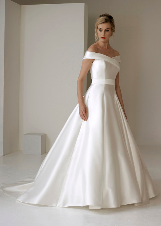 Modern, off the shoulder wedding dress with a full ballgown skirt
