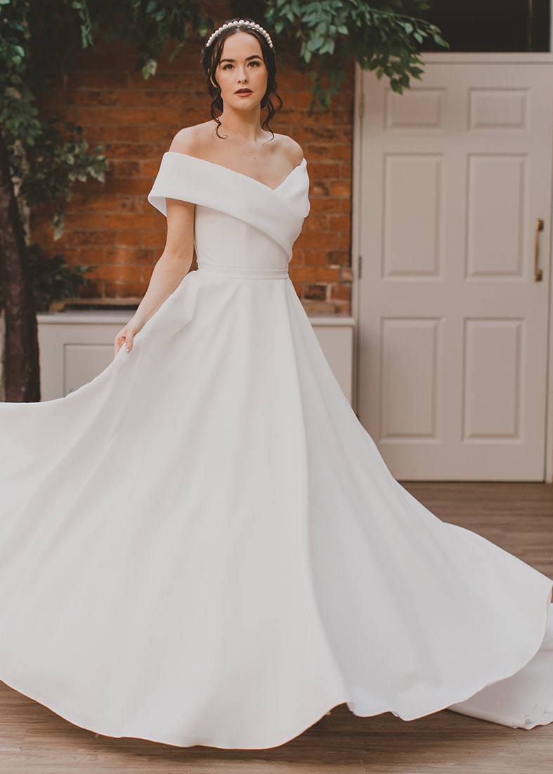 Heaven - full skirted wedding gown with a wide crossover off the shoulder neckline