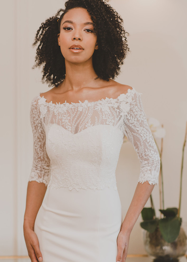 stunning bridal shrug in embroidered sequin lace and an elegant lace edged off the shoulder neckline
