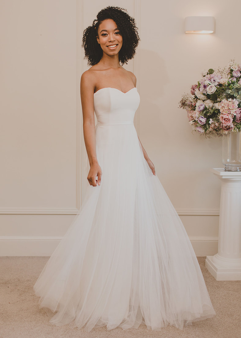 Dreamy v neck wedding dress with a soft tulle skirt in nude tones