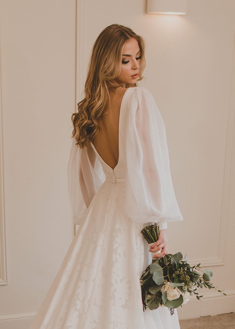 The beautiful Gardener bridal overskirt with a floral cotton feel print. Shown worn over our Loren gown