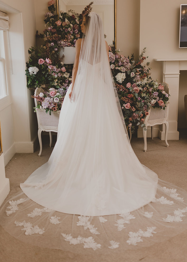 Tulle wedding veil with cathedral length train and embroidered lace details on the train & comb