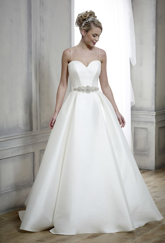 ballgown wedding dress accessorised with a wide beaded bridal belt