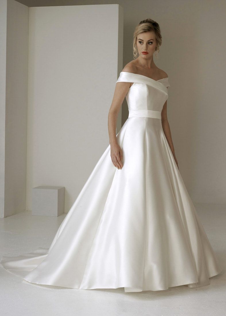 Full skirted ballgown wedding dress with train and cross over off the shoulder neckline