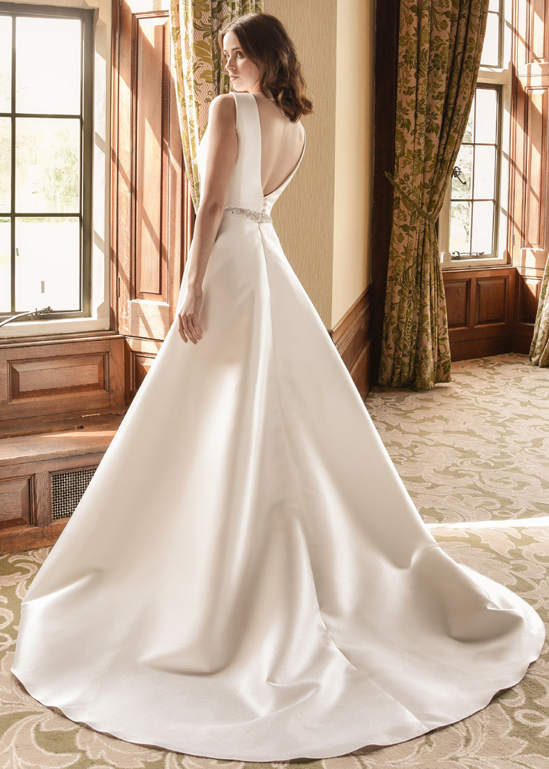 Modern A line wedding dress with a puddle train and low v back