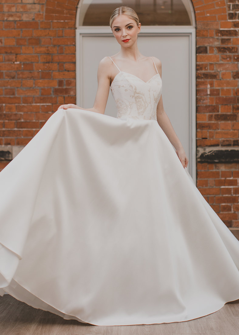 Romantic - Full skirted mikado silk wedding dress with spaghetti straps and a floral gillter tull overlay on the bodice