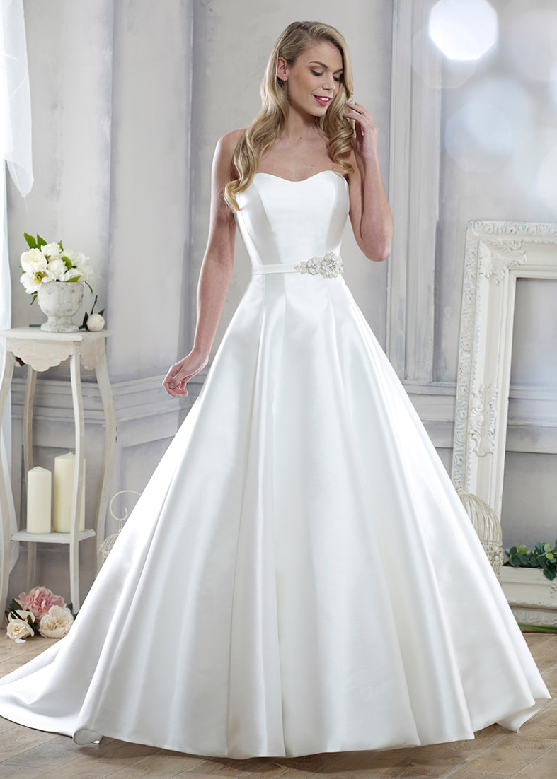 Full skirted sleeveless wedding dress with a sheer lace illusion neckline