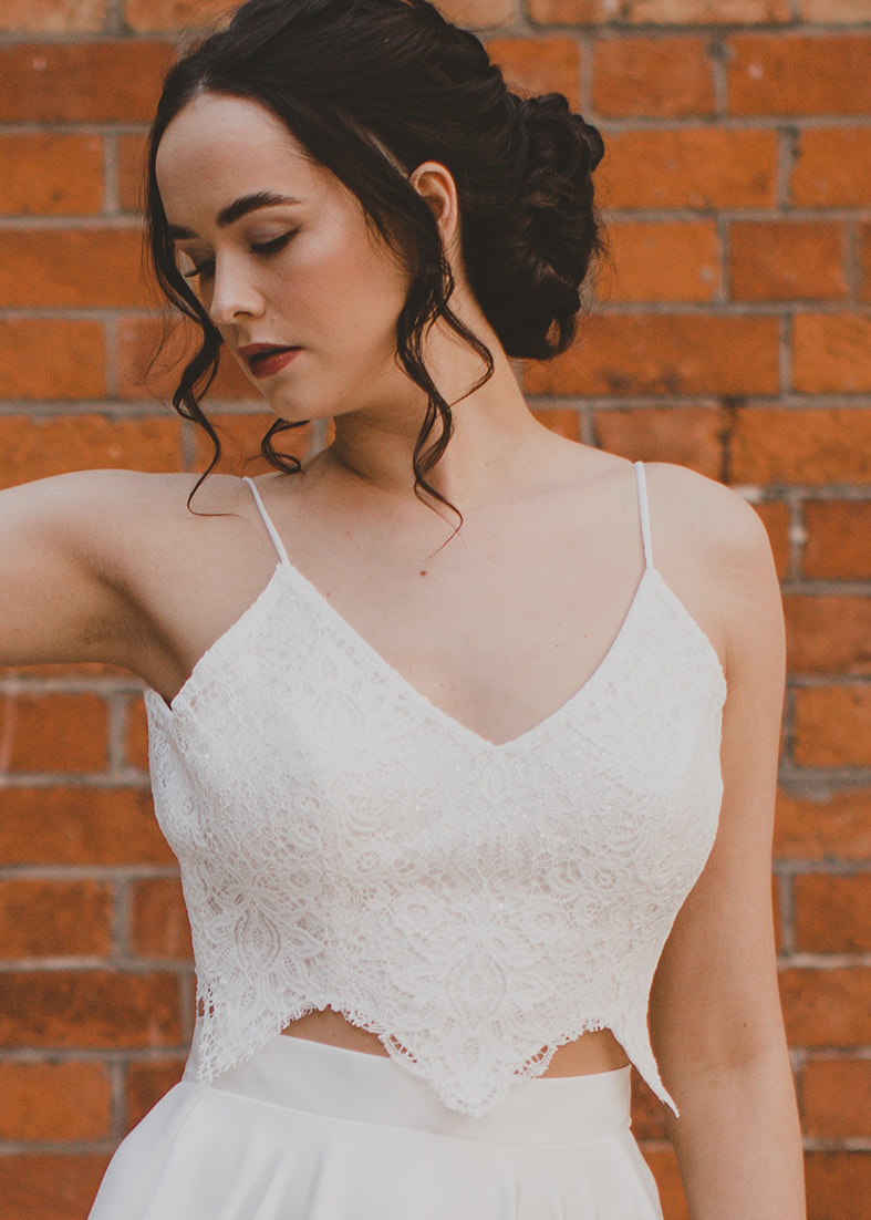 Sweetness Crop Top - Cropped guipure lace bridal bodice with spaghetti straps, v neckline and a scalloped lace detail around the bottom. Worn with a crepe bridal skirt