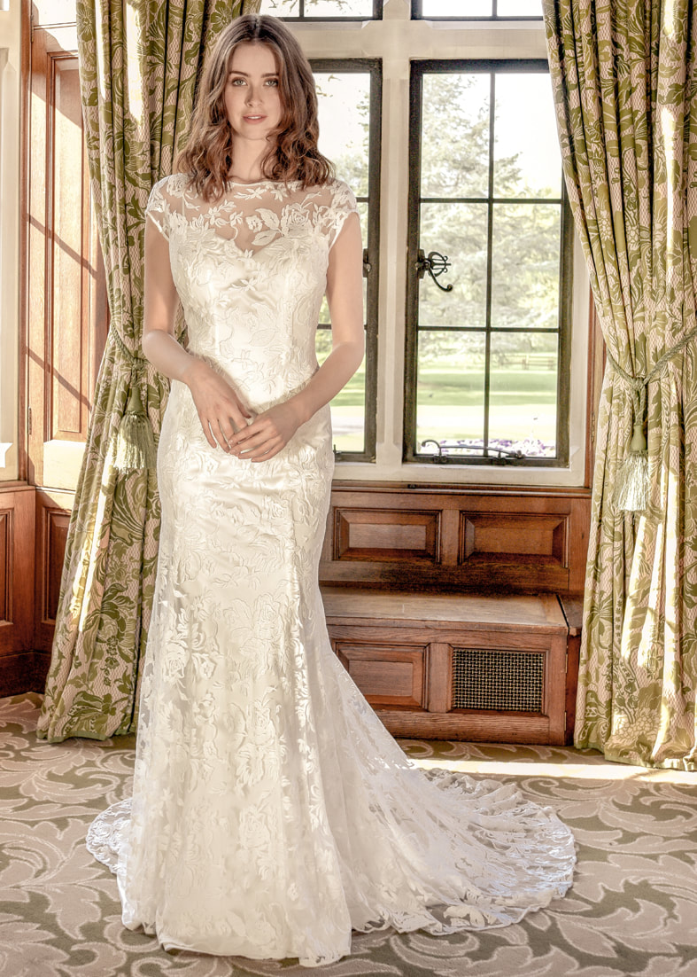 Satin slip wedding dress worn with a sheer embroidered tulle overdress