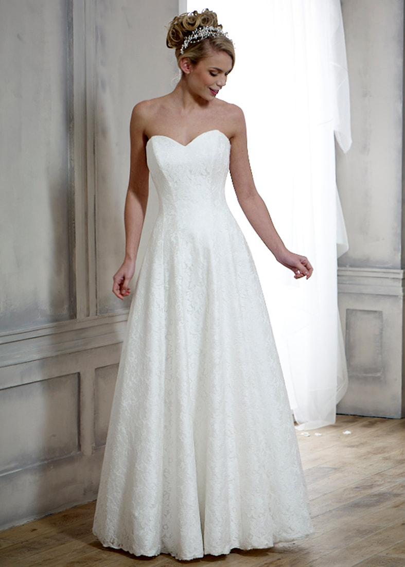 fitted lace wedding dress with a low sheer back
