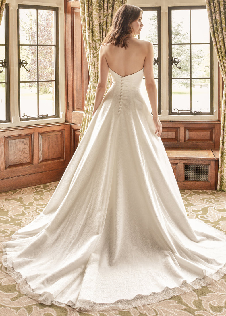 Sttrapless embroidered tulle wedding dress with train and button back  