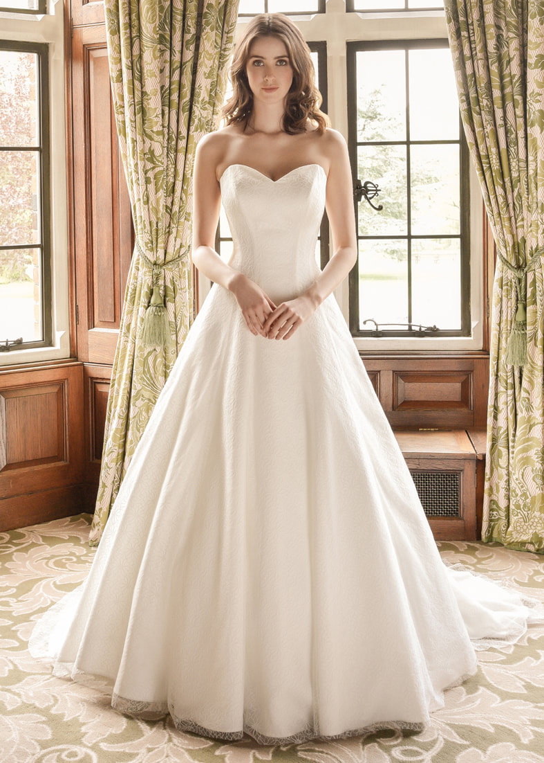 Strapless embroidered tulle wedding dress with a full skirt and sweetheart neckline